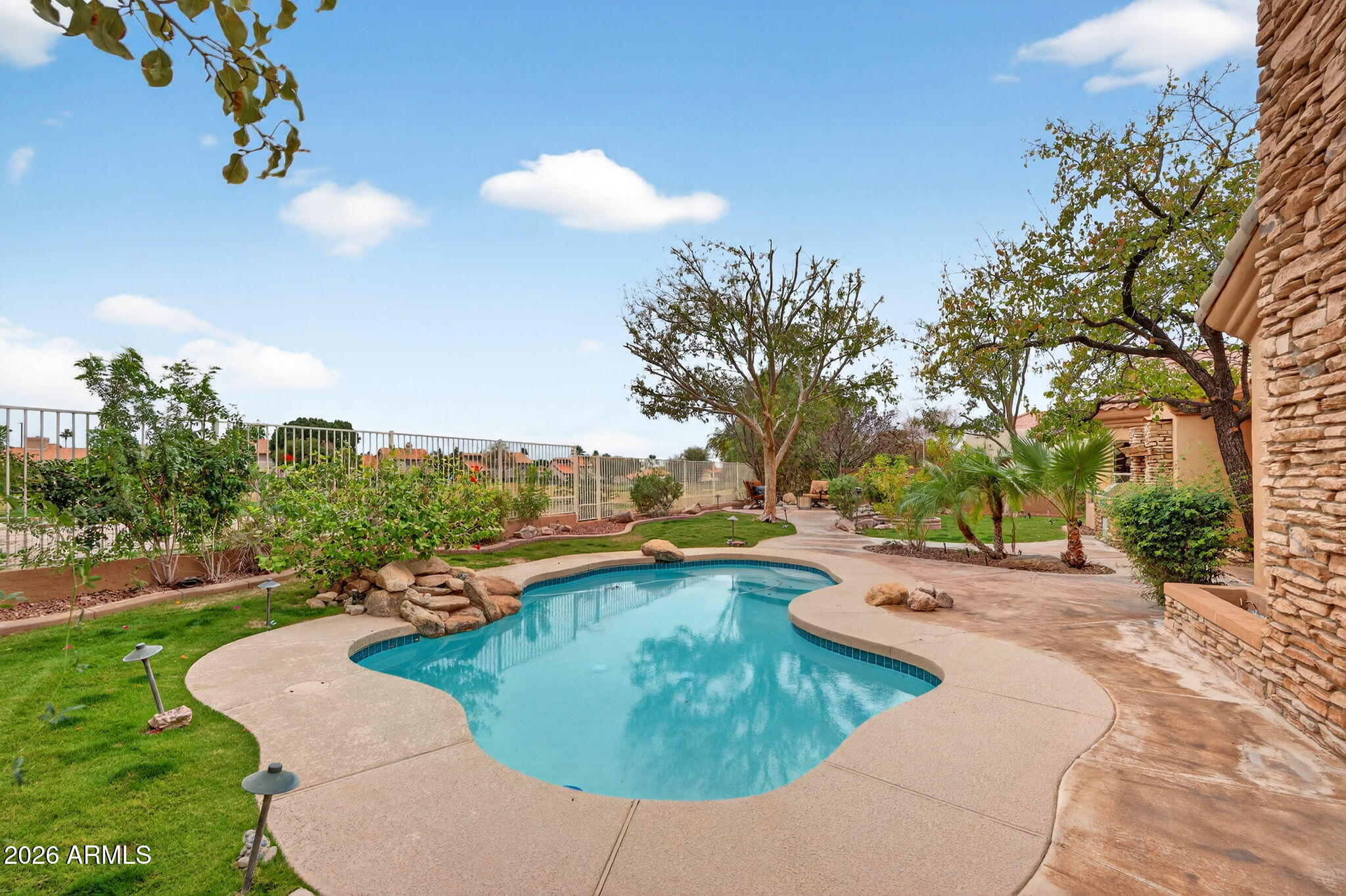 4055 North Recker Road, Unit 18 Mesa, AZ 85215 - Photo 28 of 63 a view of a swimming pool with a yard