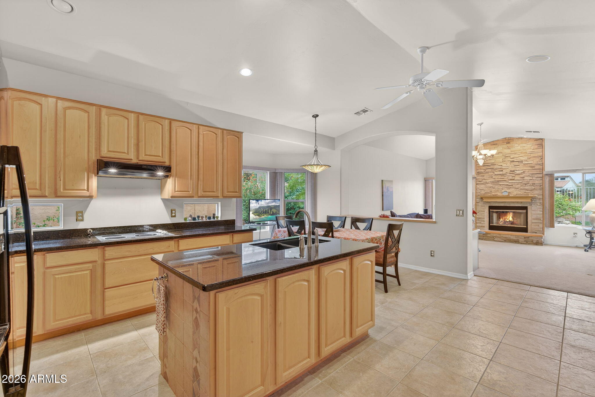 4055 North Recker Road, Unit 18 Mesa, AZ 85215 - Photo 3 of 63 a kitchen with stainless steel appliances granite countertop a sink stove and cabinets
