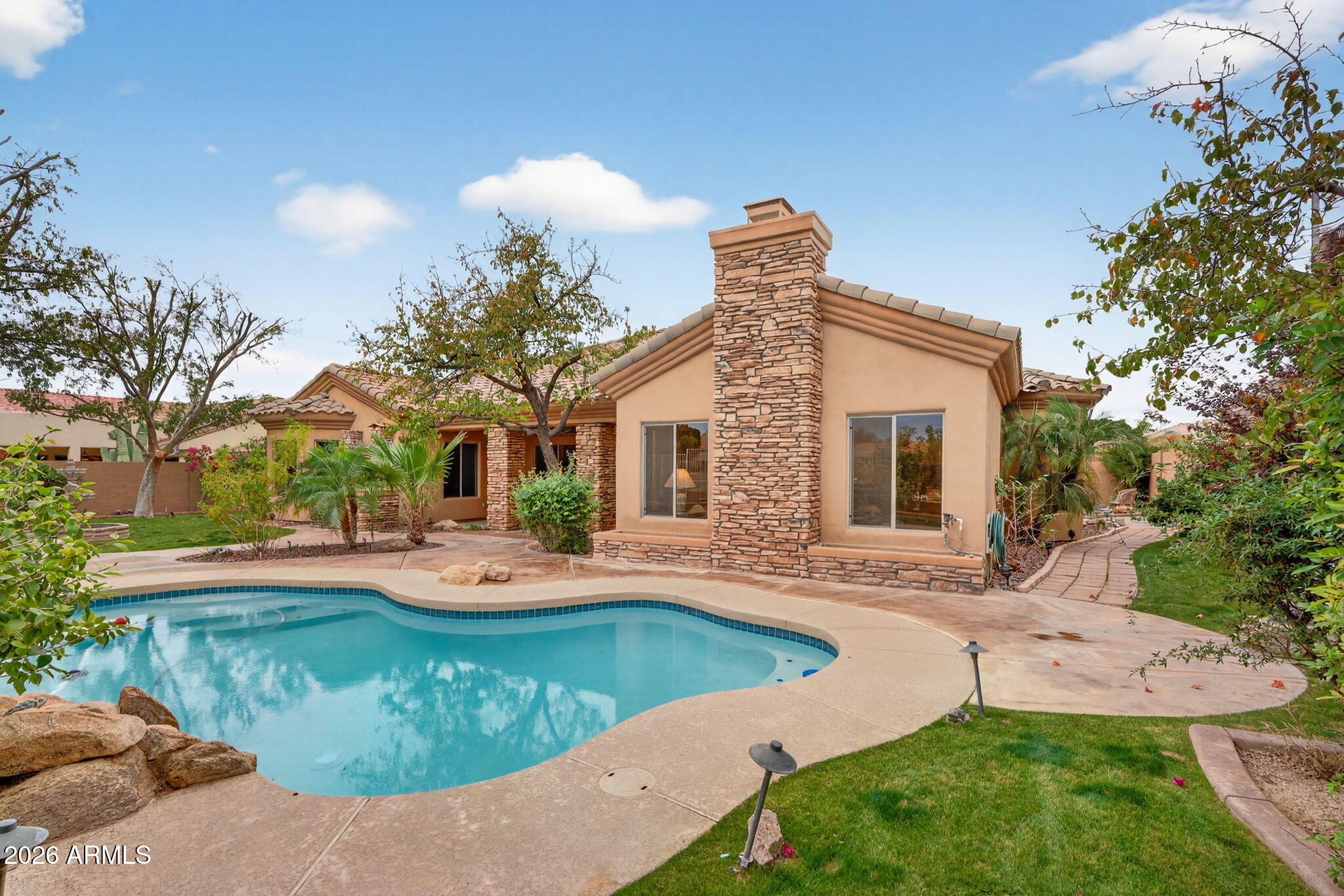4055 North Recker Road, Unit 18 Mesa, AZ 85215 - Photo 5 of 63 a view of a house with swimming pool and sitting area
