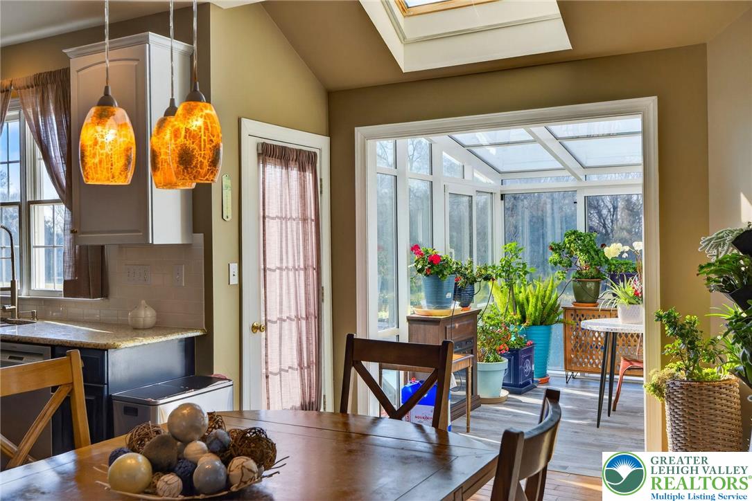 591 Rockbridge Road Nazareth, PA 18064 - Photo 14 of 73 a living room filled with furniture and a floor to ceiling window