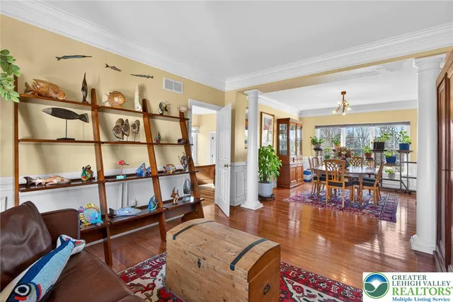 a view of a dining room with furniture window and wooden floor