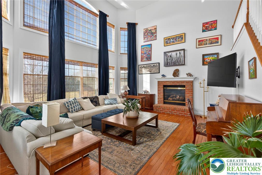 591 Rockbridge Road Nazareth, PA 18064 - Photo 24 of 73 a living room with fireplace furniture and a flat screen tv