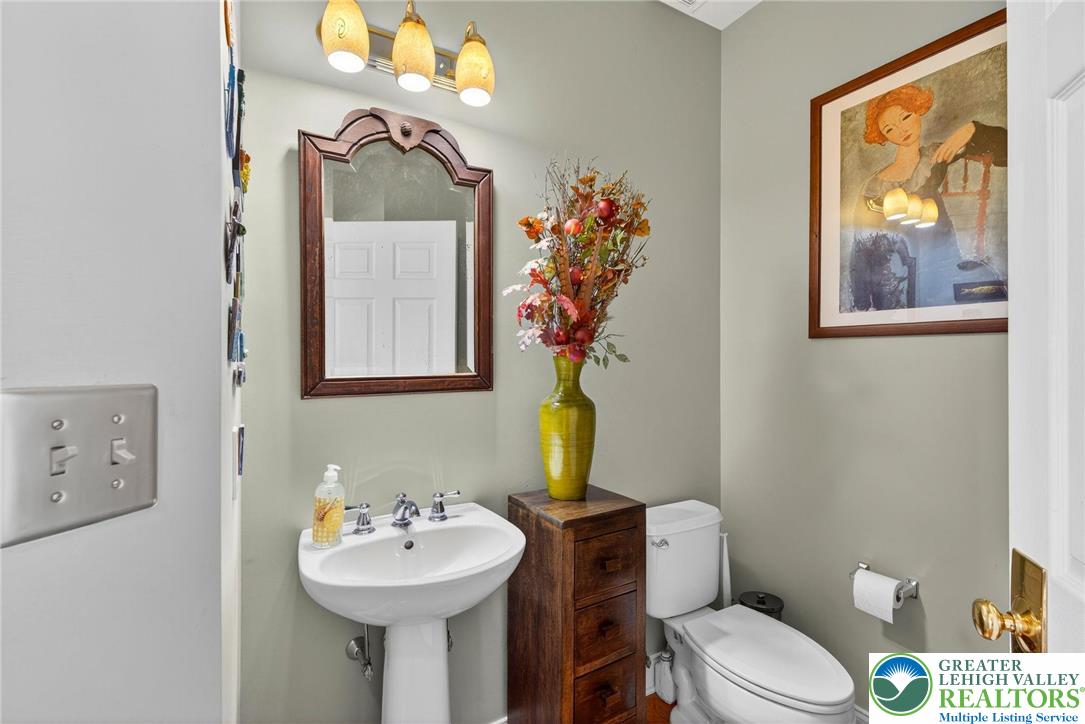 591 Rockbridge Road Nazareth, PA 18064 - Photo 28 of 73 a bathroom with a sink mirror and toilet