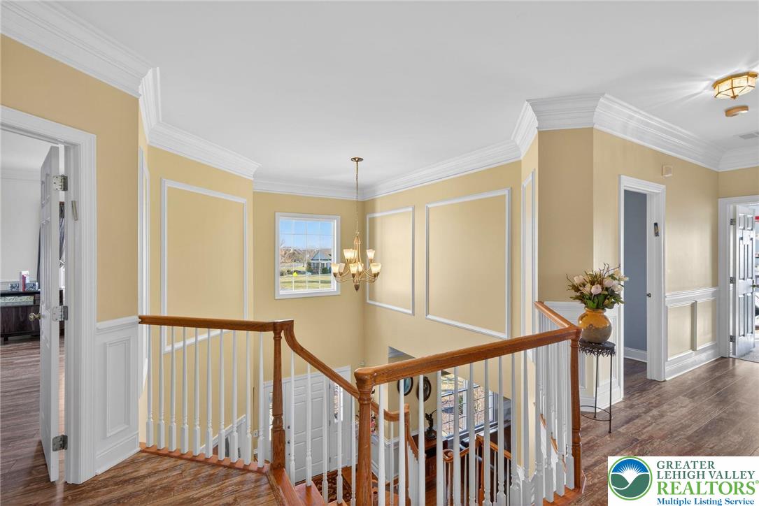 591 Rockbridge Road Nazareth, PA 18064 - Photo 35 of 73 a view of a hallway to a livingroom with wooden floor and furniture