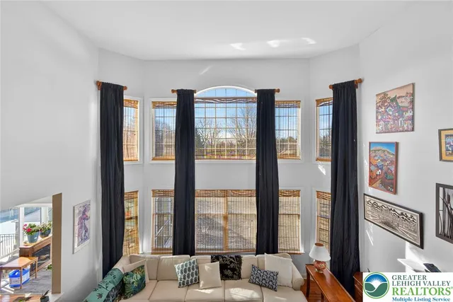 a en suite bathroom with a granite countertop sink and a mirror