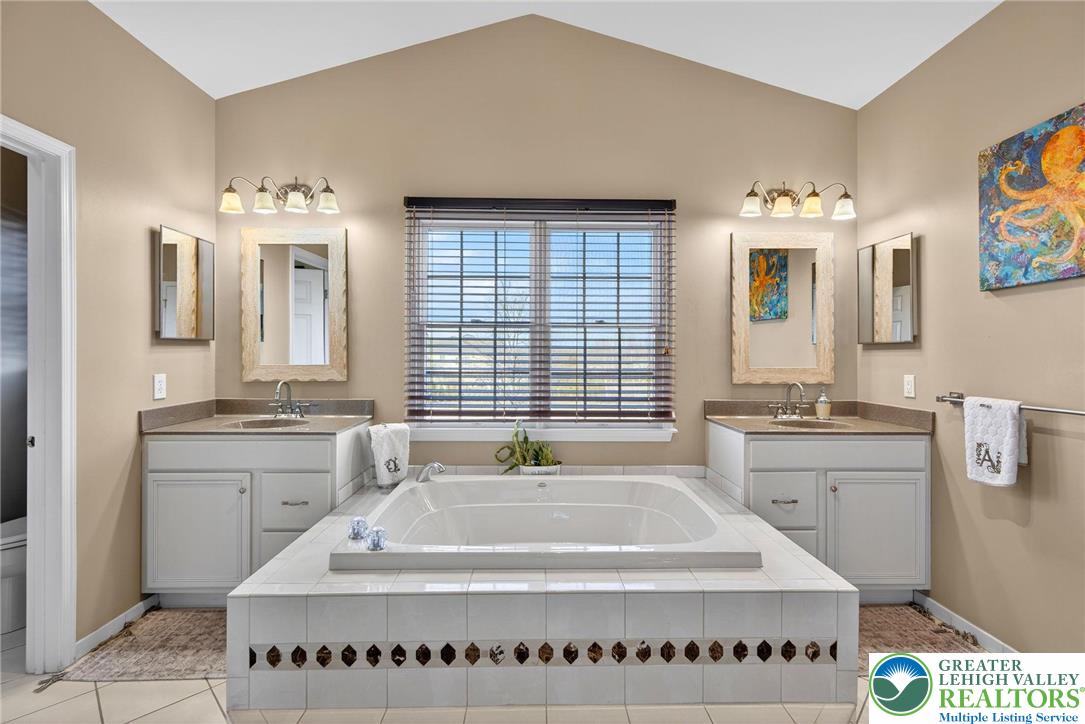 591 Rockbridge Road Nazareth, PA 18064 - Photo 44 of 73 a bathroom with a tub sink and mirror