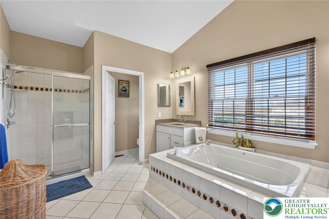 591 Rockbridge Road Nazareth, PA 18064 - Photo 45 of 73 a spacious bathroom with a granite countertop tub and a sink