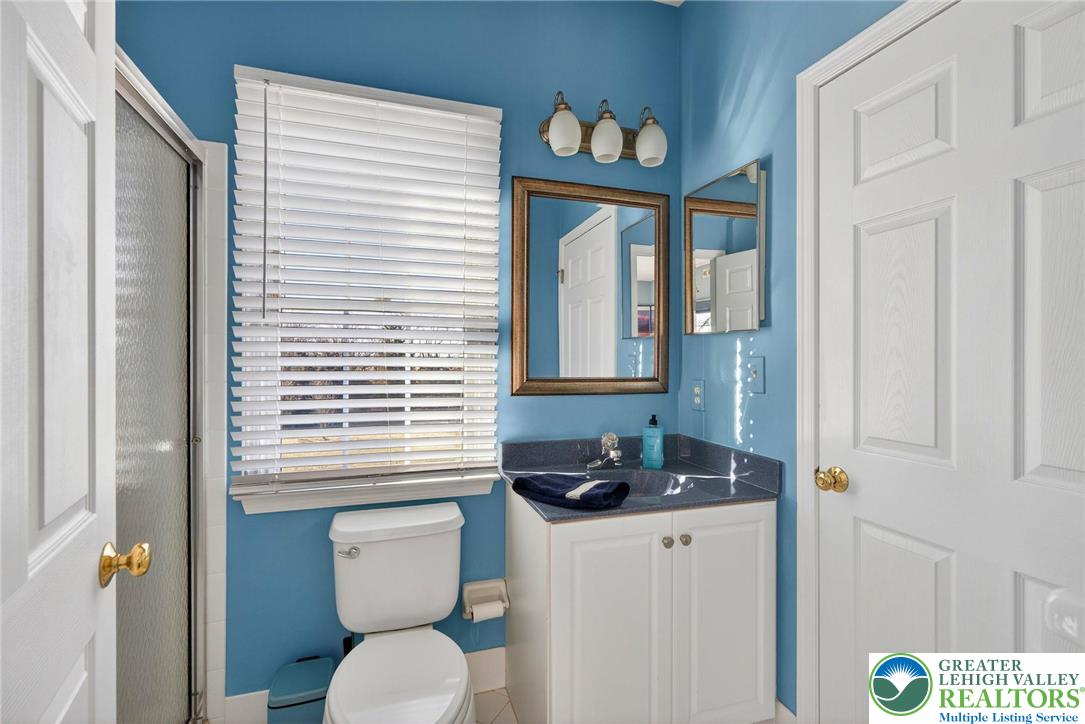 591 Rockbridge Road Nazareth, PA 18064 - Photo 49 of 73 a bathroom with a toilet a sink and a window