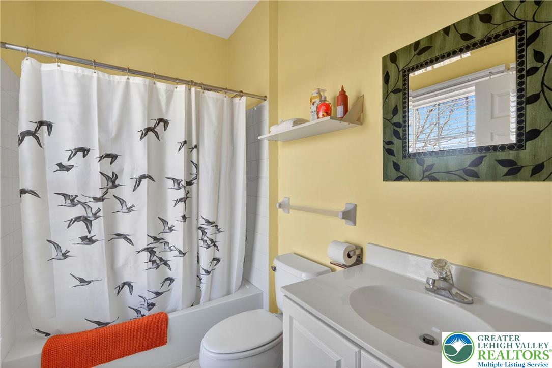 591 Rockbridge Road Nazareth, PA 18064 - Photo 51 of 73 a bathroom with a sink a toilet and shower curtain