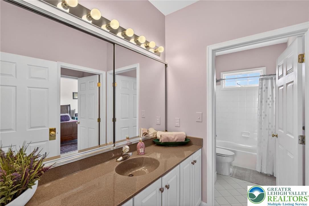 591 Rockbridge Road Nazareth, PA 18064 - Photo 54 of 73 a en suite bathroom with a granite countertop sink and a mirror