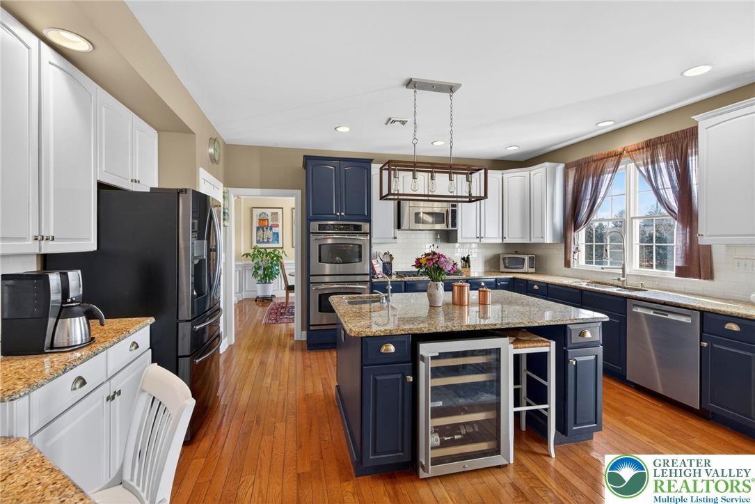 591 Rockbridge Road Nazareth, PA 18064 - Photo 6 of 73 a kitchen with stainless steel appliances granite countertop a stove and refrigerator