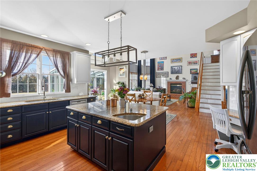 591 Rockbridge Road Nazareth, PA 18064 - Photo 10 of 73 a kitchen with sink cabinets and wooden floor