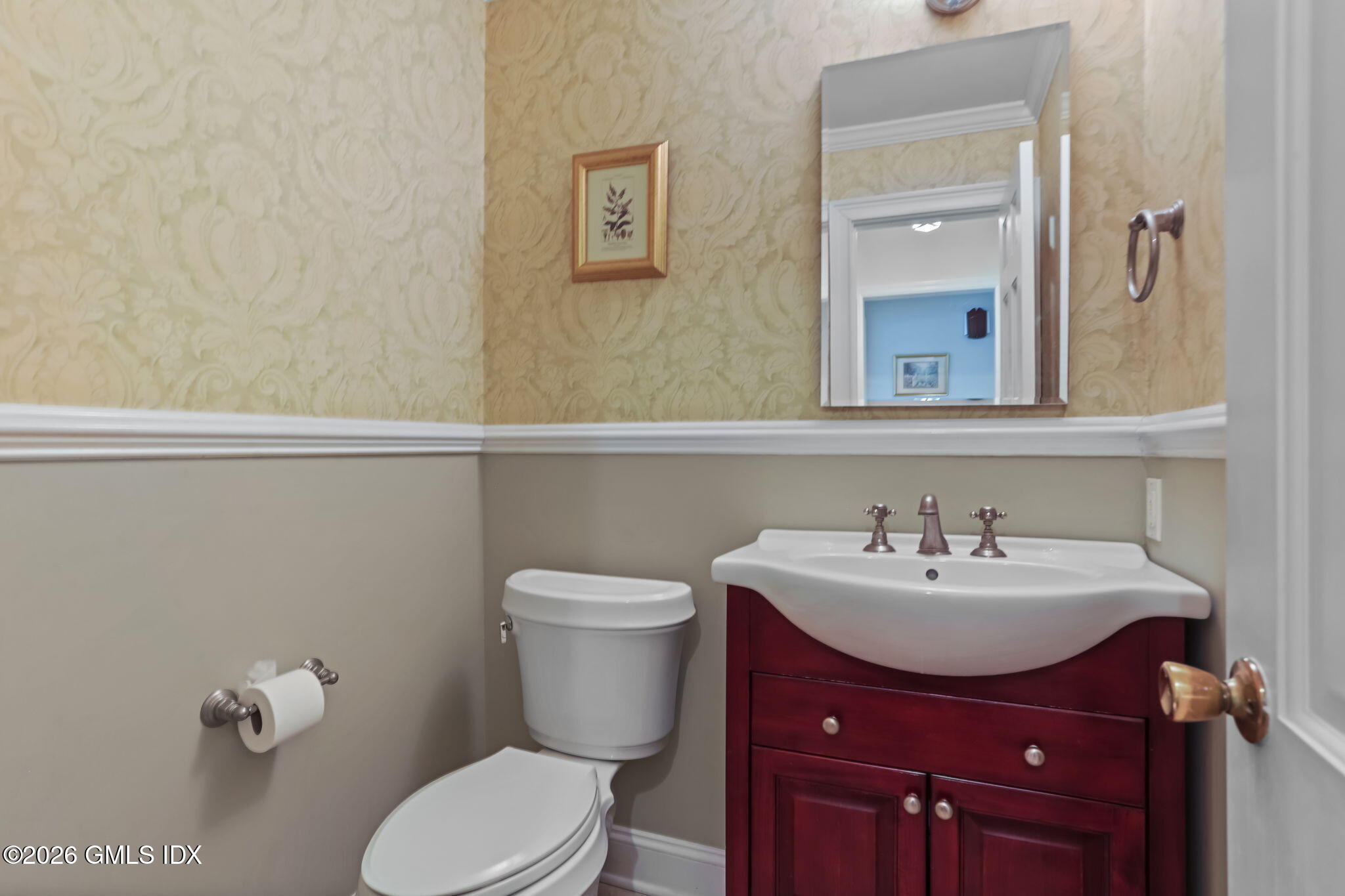 153 Lockwood Road Riverside, CT 06878 - Photo 14 of 58 a bathroom with a sink mirror and toilet