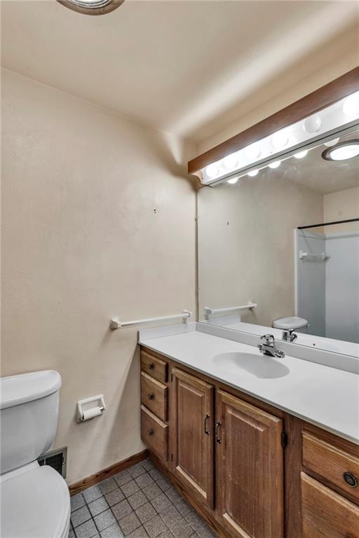 617 Blueberry Road Monroeville, PA 15146 - Photo 16 of 38 a bathroom with a granite countertop sink a toilet and a mirror
