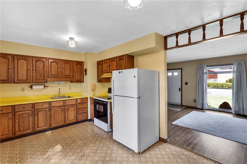 617 Blueberry Road Monroeville, PA 15146 - Photo 17 of 38 a kitchen with stainless steel appliances granite countertop a refrigerator sink and cabinets