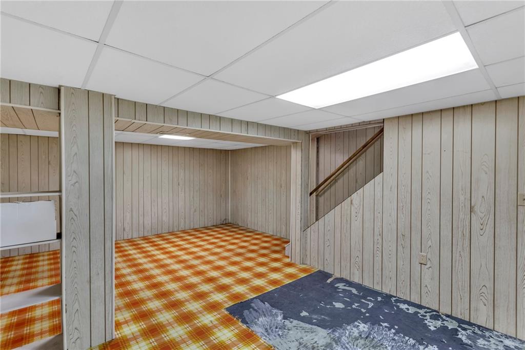 617 Blueberry Road Monroeville, PA 15146 - Photo 24 of 38 a bedroom with a bed and a walk in closet with wooden floor