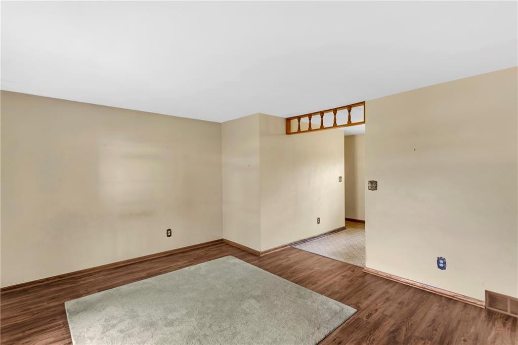 617 Blueberry Road Monroeville, PA 15146 - Photo 4 of 38 an empty room with wooden floor