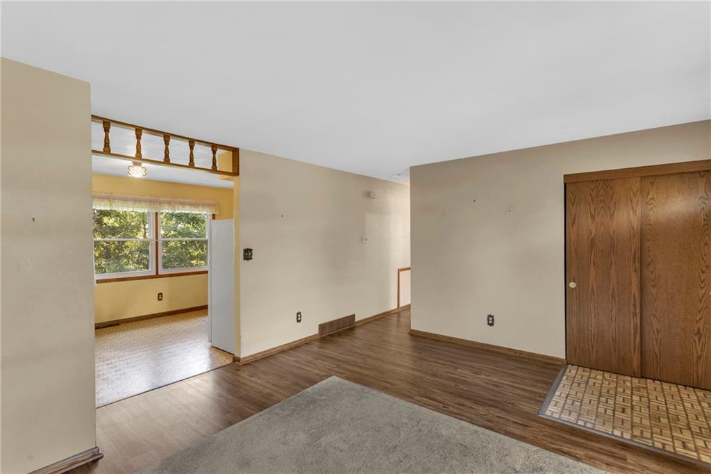 617 Blueberry Road Monroeville, PA 15146 - Photo 5 of 38 a view of an empty room with wooden floor and a window
