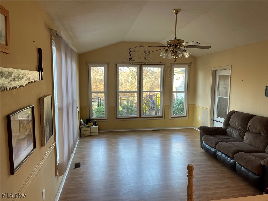 170 Burns Road Elyria, OH 44035 - Photo 14 of 32 Living room featuring wood-type LVT flooring, and ceiling fan