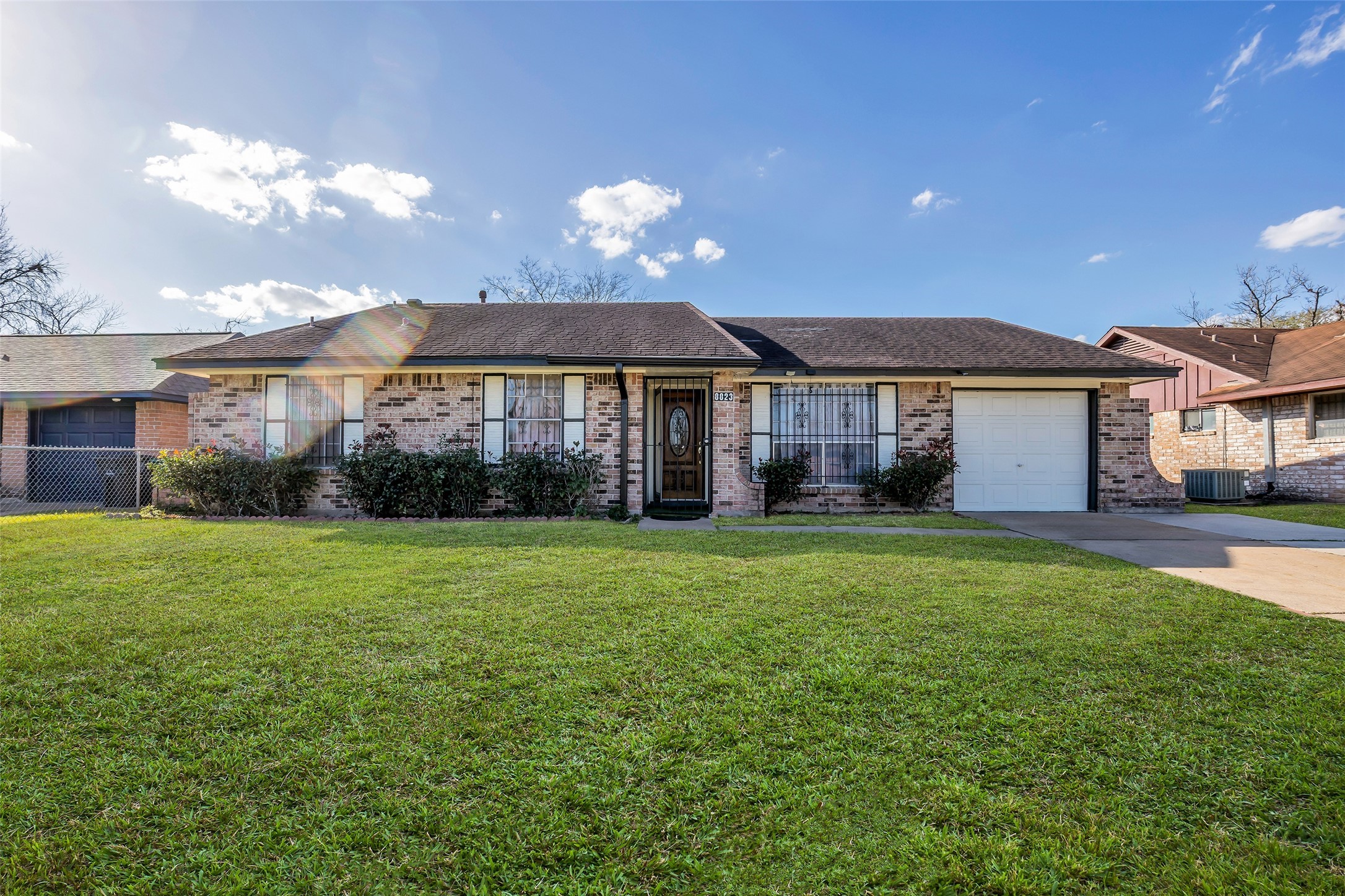 a view of a house with a backyard