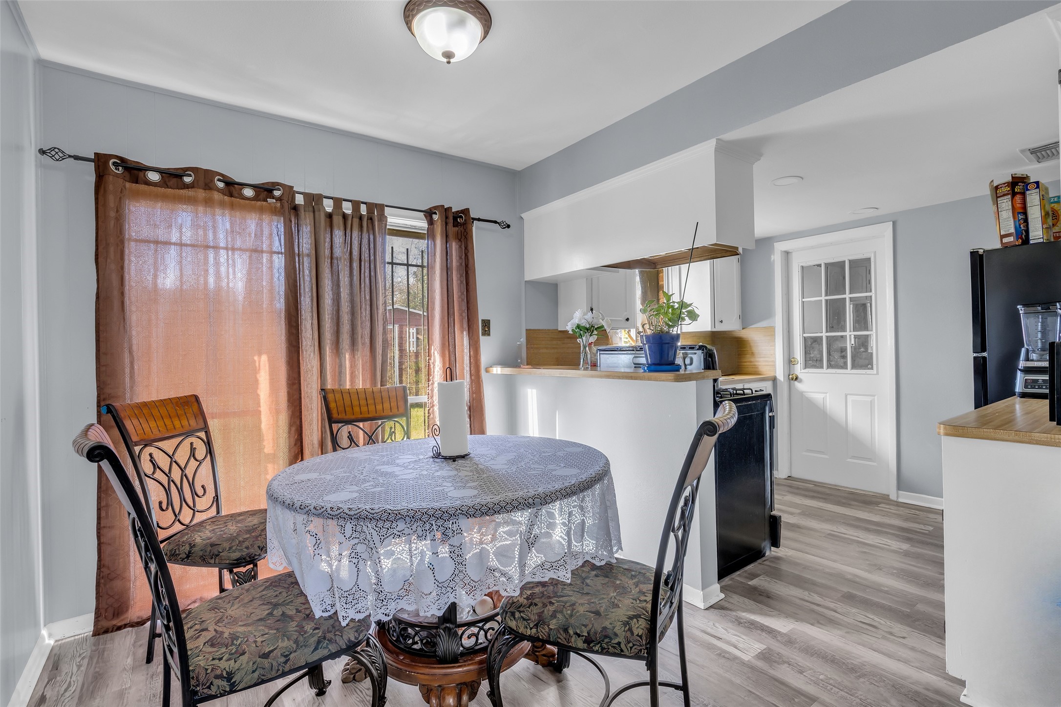 8823 Rutherford Lane Houston, TX 77088 - Photo 5 of 19 a view of a dining room with furniture and window
