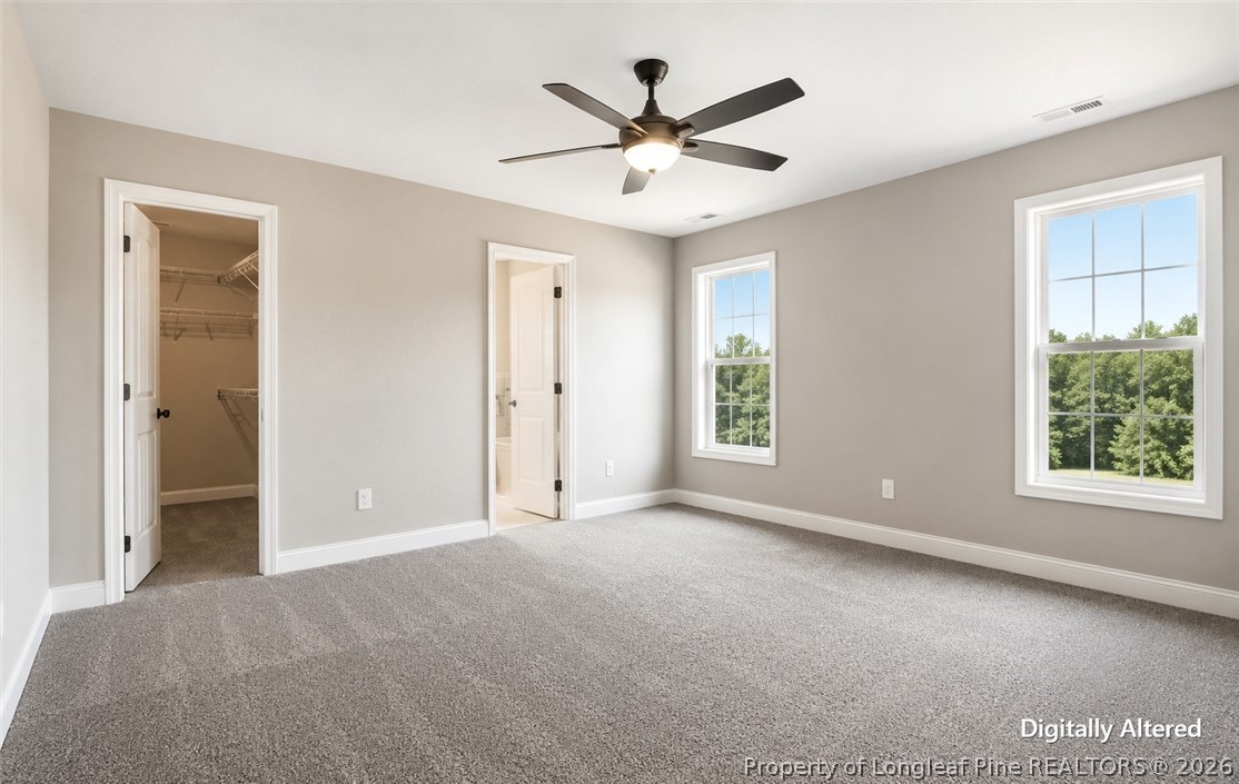 756 Jordan Road Autryville, NC 28318 - Photo 17 of 34 a view of a livingroom with a ceiling fan and window