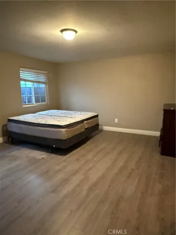 a room with a bed and a window