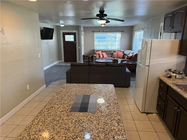a living room with a couch and a chandelier