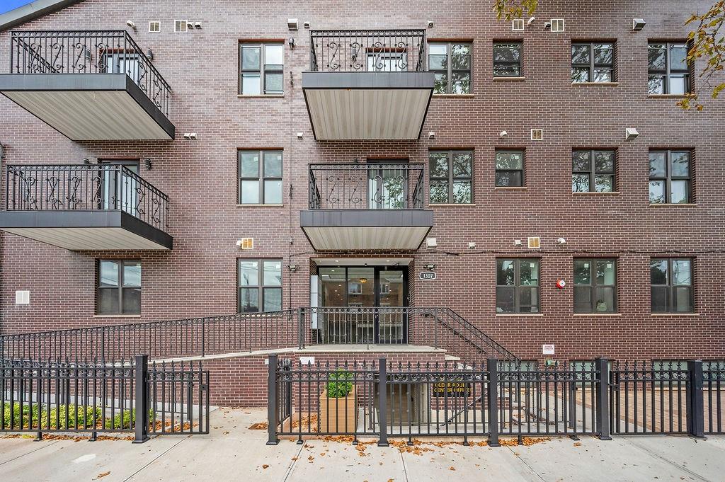 1307 84th Street, Unit 3A Brooklyn, NY 11228 - Photo 1 of 18 a front view of a house with a balcony