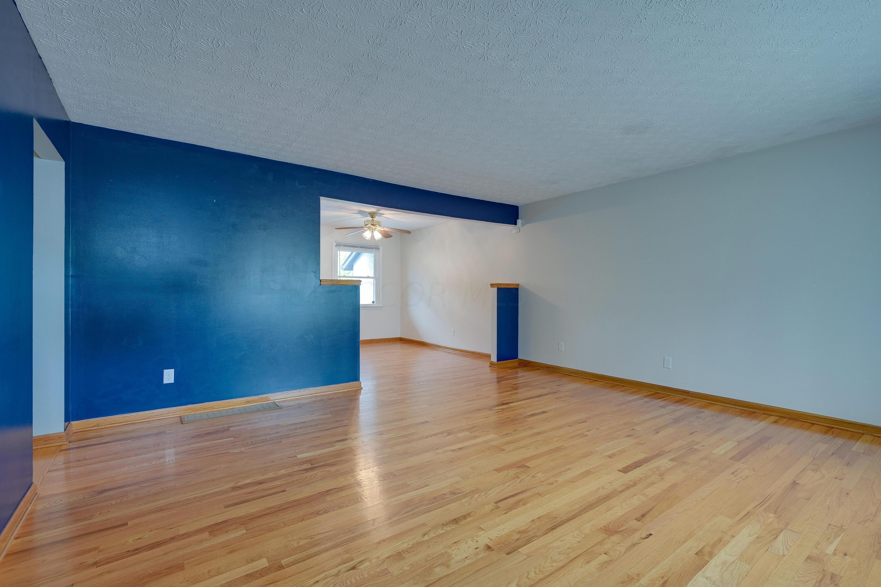 5383 Pine Bluff Road Columbus, OH 43229 - Photo 5 of 32 Living Room with beautiful hardwood floors