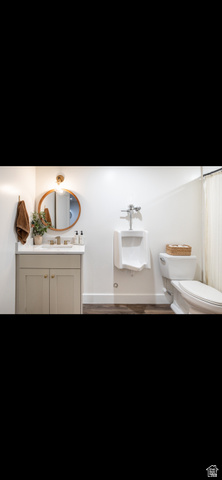 1276 West Fallow Way, Unit 76 Ogden, UT 84414 - Photo 12 of 22 Bathroom with vanity and dark wood-type flooring