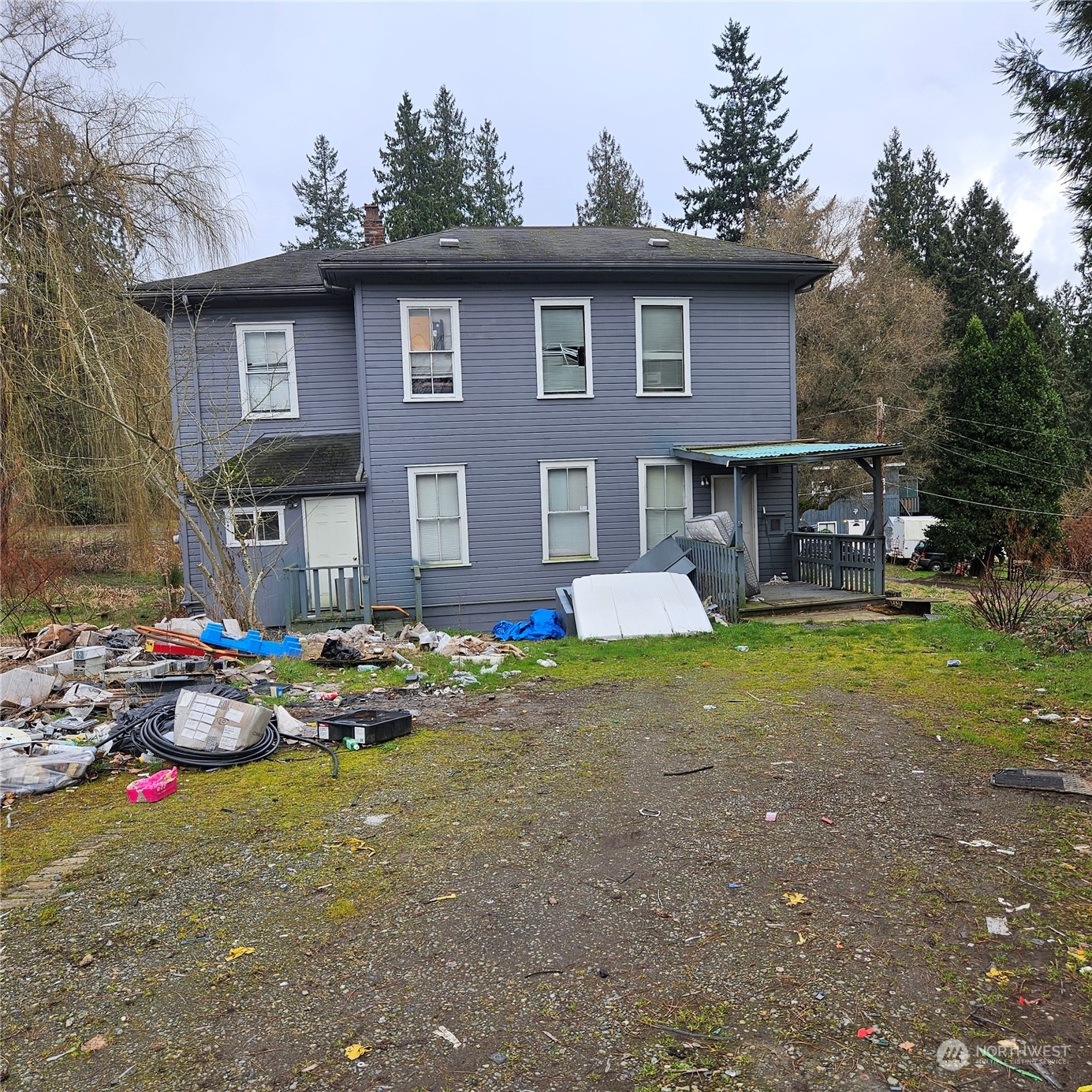 19221 Talbot Road South Renton, WA 98055 - Photo 1 of 2 a backyard of a house with garden and outdoor seating