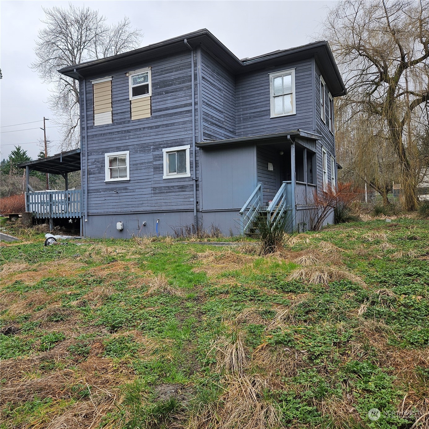 19221 Talbot Road South Renton, WA 98055 - Photo 2 of 2 a view of a house with a yard