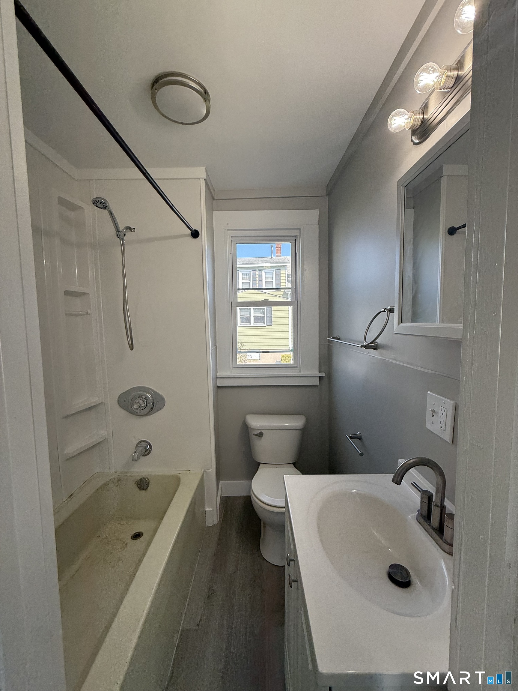420 Short Beach Road East Haven, CT 06512 - Photo 11 of 23 a bathroom with a sink a toilet and shower