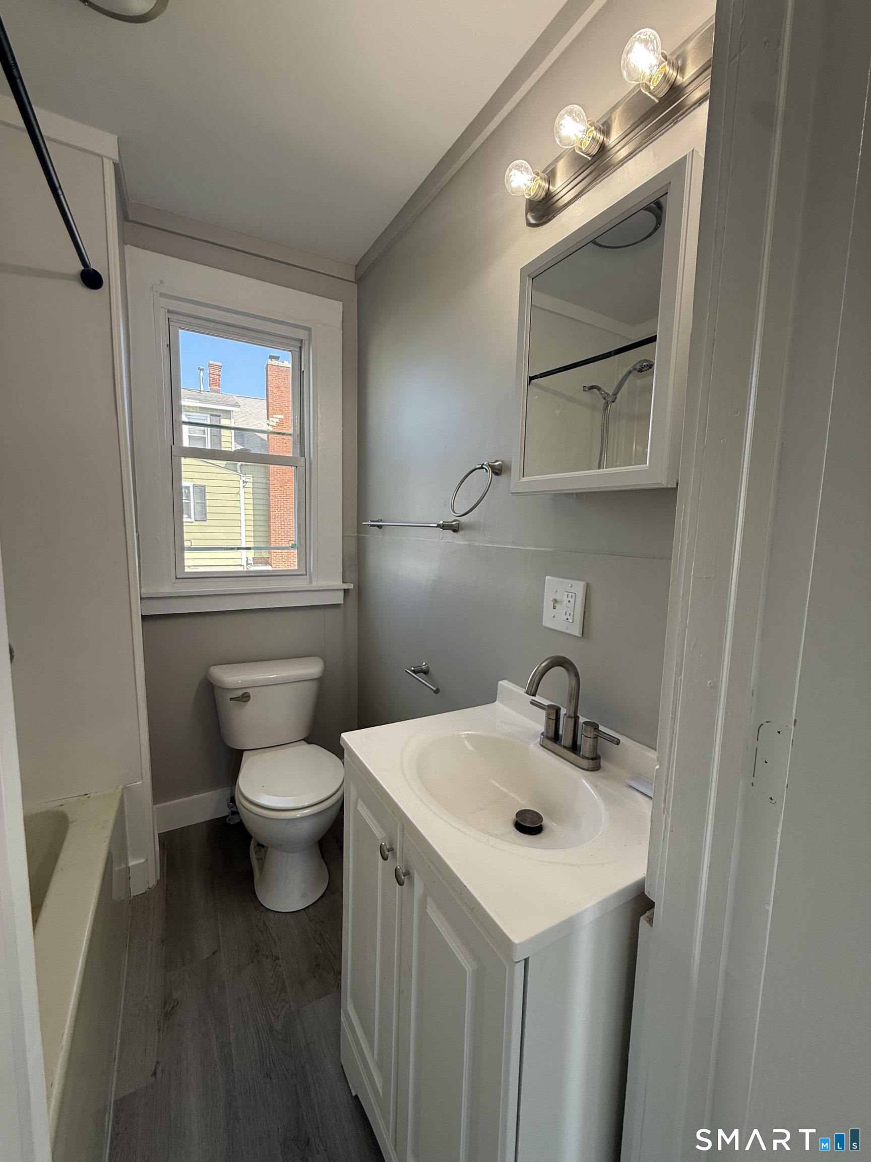 420 Short Beach Road East Haven, CT 06512 - Photo 17 of 23 a bathroom with a sink mirror and toilet