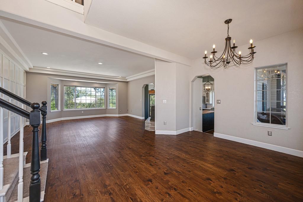 3154 Twin K Road Pilot Hill, CA 95664 - Photo 27 of 89 a view of an empty room with wooden floor and a window