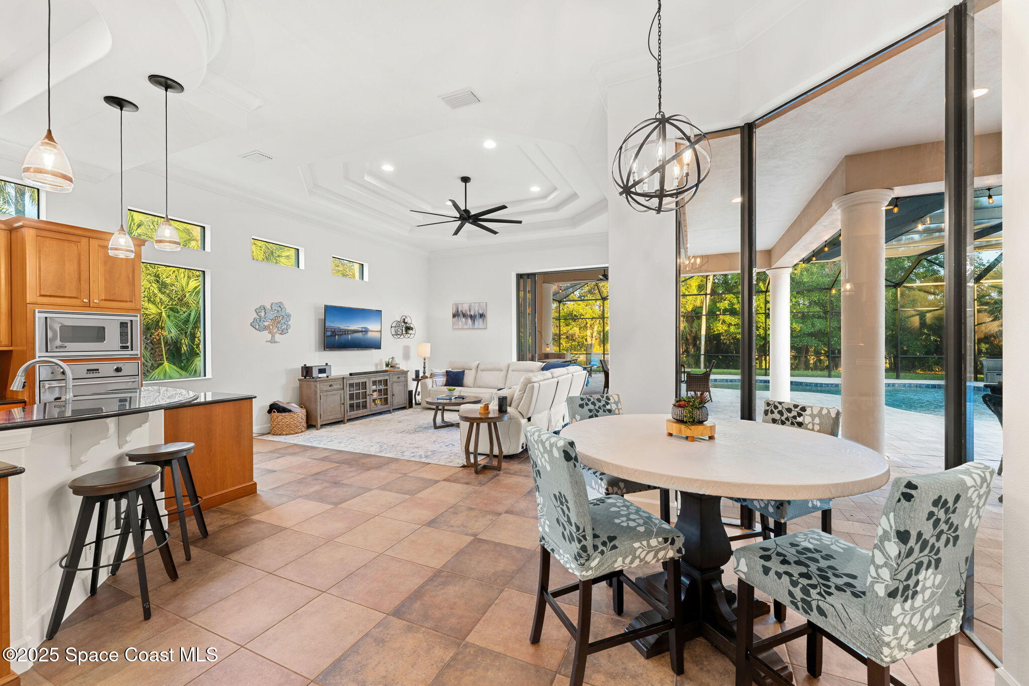 4447 Reseda Way Rockledge, FL 32955 - Photo 12 of 87 a view of a dining room with furniture window and wooden floor