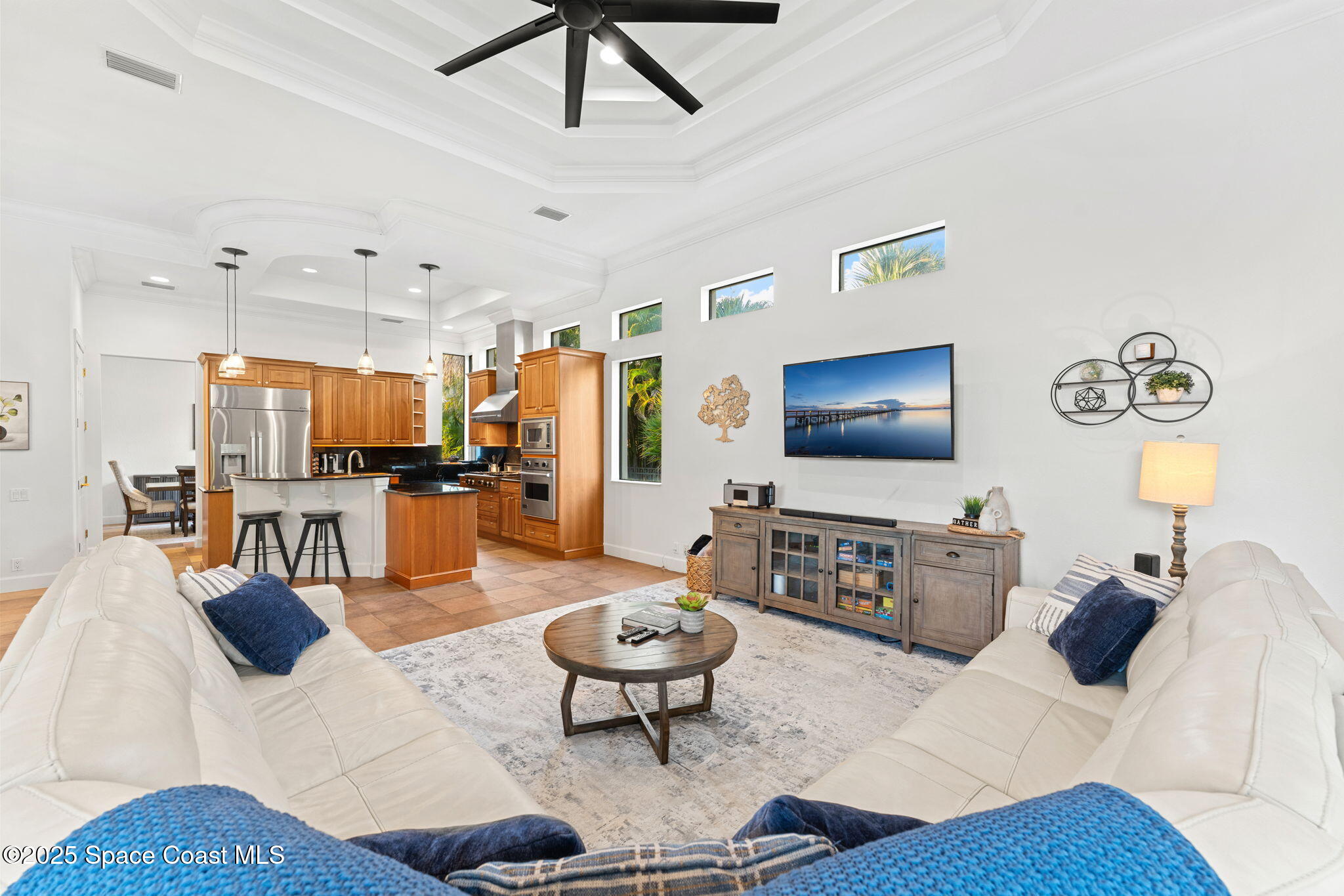 4447 Reseda Way Rockledge, FL 32955 - Photo 16 of 87 a living room with furniture and a flat screen tv
