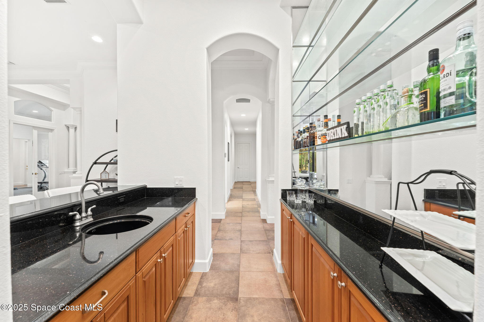 4447 Reseda Way Rockledge, FL 32955 - Photo 24 of 87 a kitchen with a sink and a stove top oven