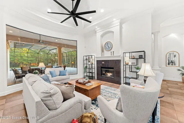 a view of a livingroom with furniture and a window