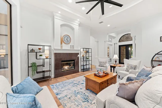 a room with gym equipment and a view of living room
