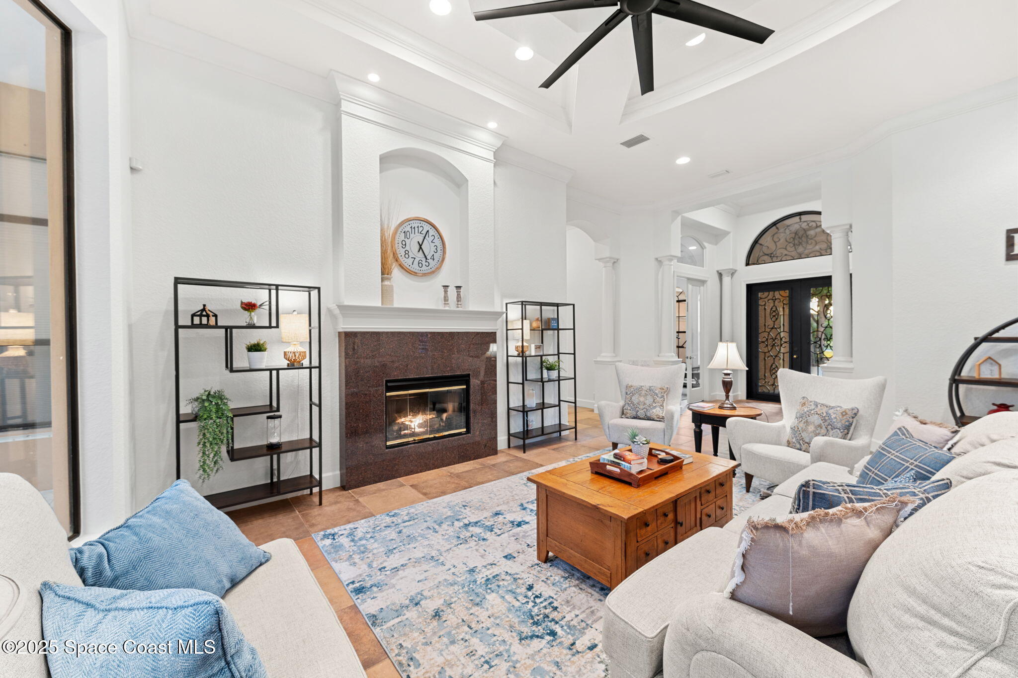 4447 Reseda Way Rockledge, FL 32955 - Photo 28 of 87 a living room with furniture and a fireplace