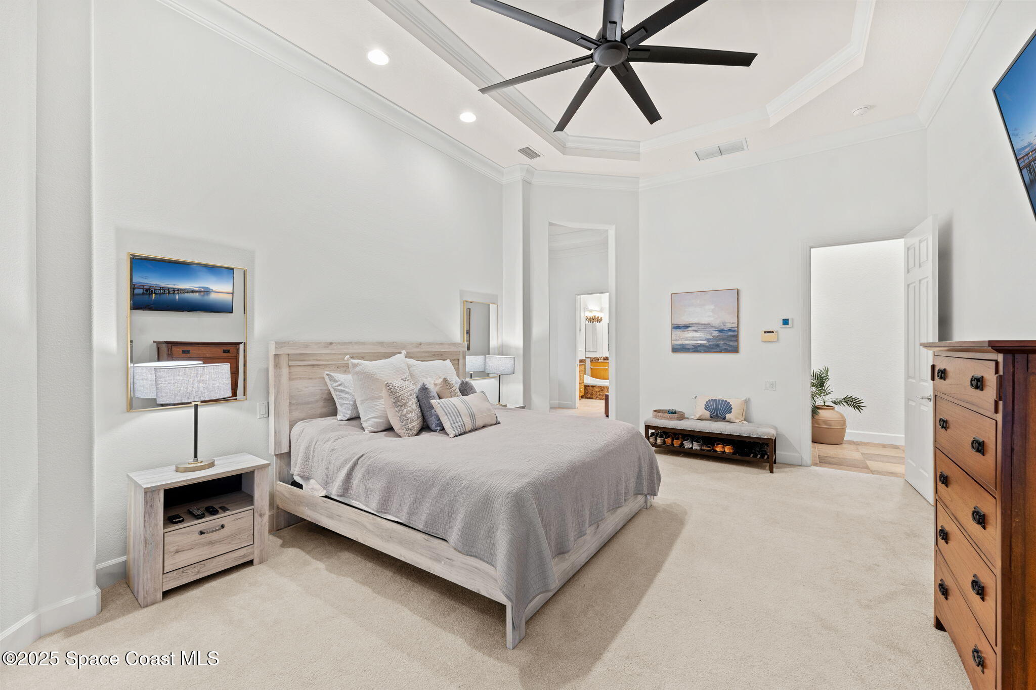 4447 Reseda Way Rockledge, FL 32955 - Photo 29 of 87 a bedroom with a bed and ceiling fan