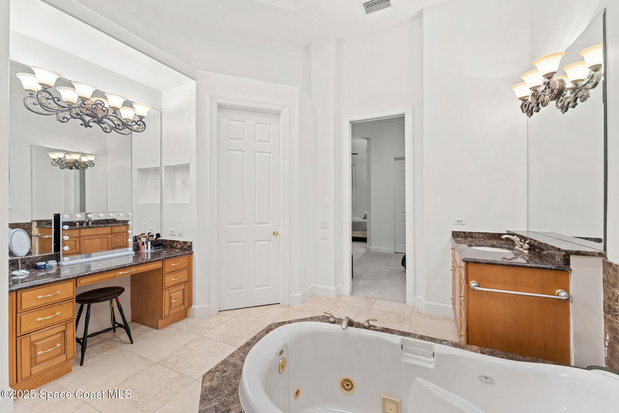 4447 Reseda Way Rockledge, FL 32955 - Photo 34 of 87 a bathroom with a tub sink and mirror