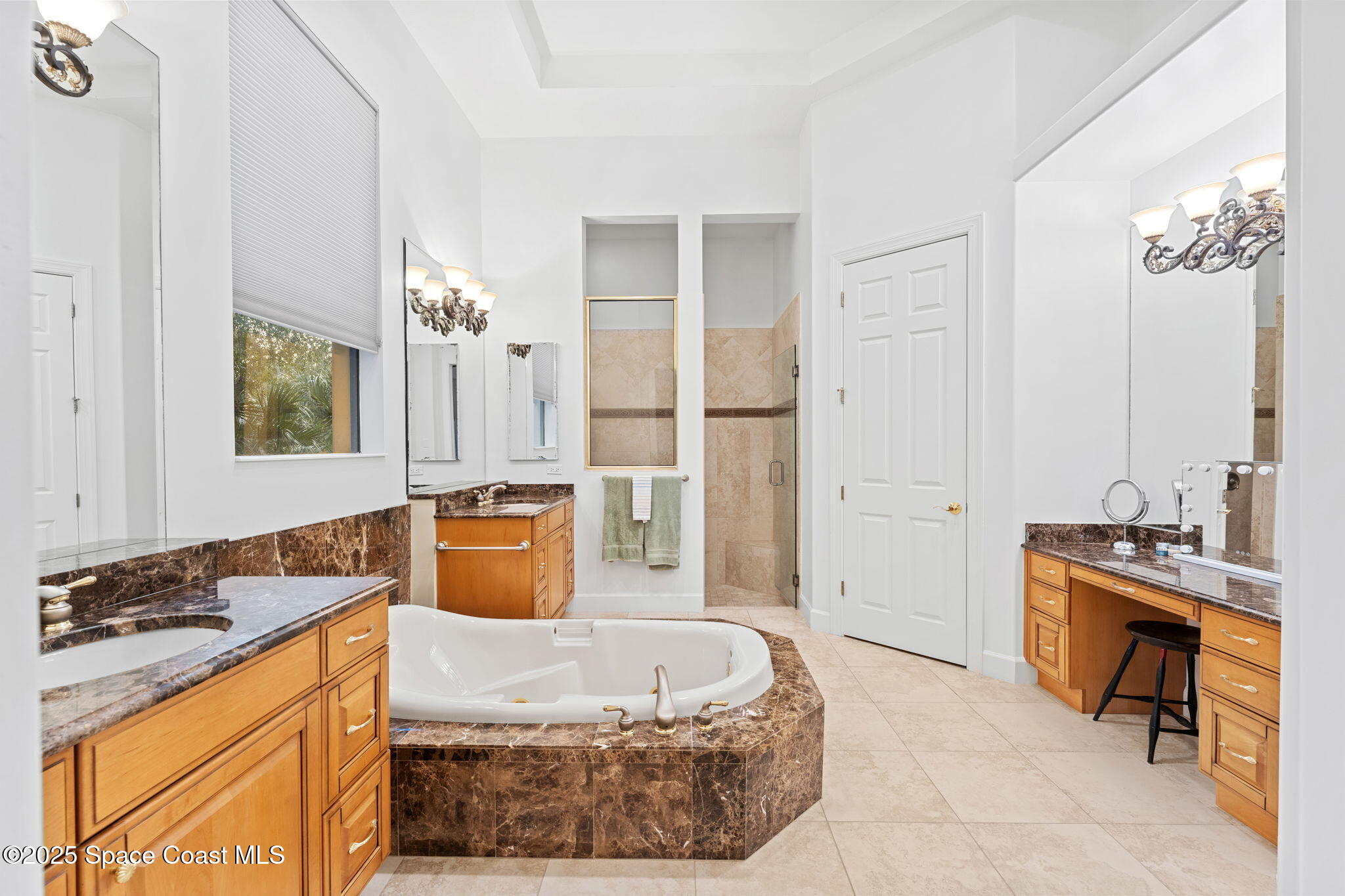 4447 Reseda Way Rockledge, FL 32955 - Photo 35 of 87 a spacious bathroom with a tub sink and mirror