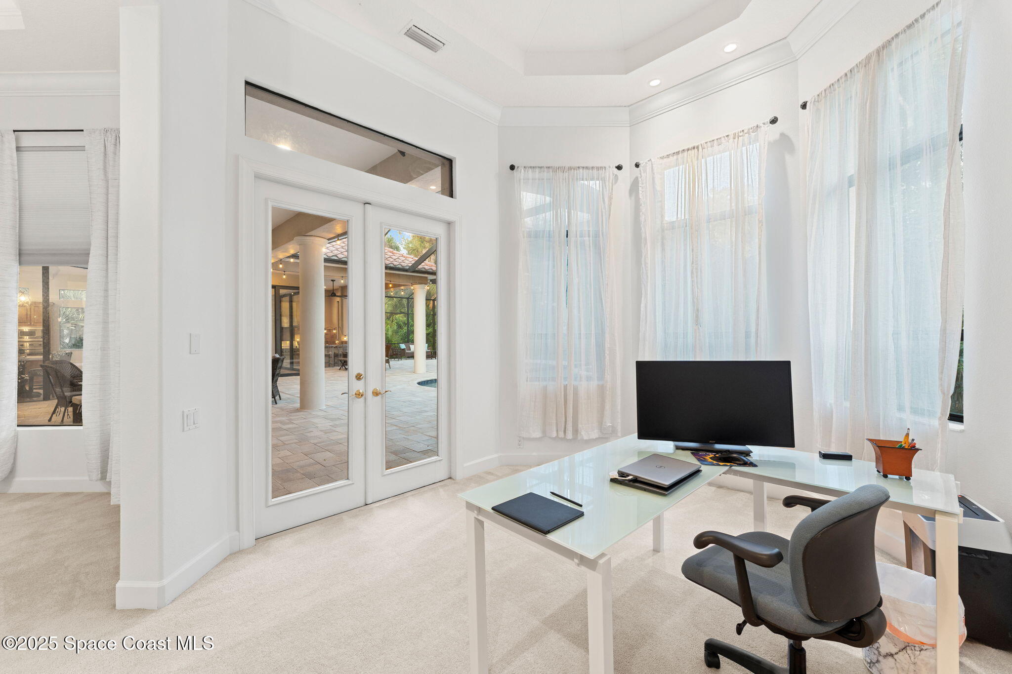 4447 Reseda Way Rockledge, FL 32955 - Photo 38 of 87 a view of a workspace with furniture and a flat screen tv
