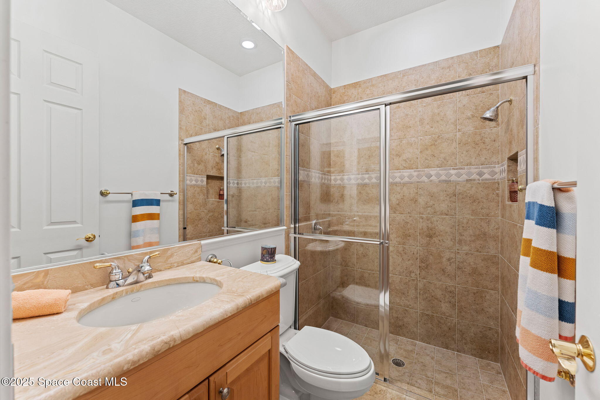 4447 Reseda Way Rockledge, FL 32955 - Photo 51 of 87 a bathroom with a sink a toilet and shower