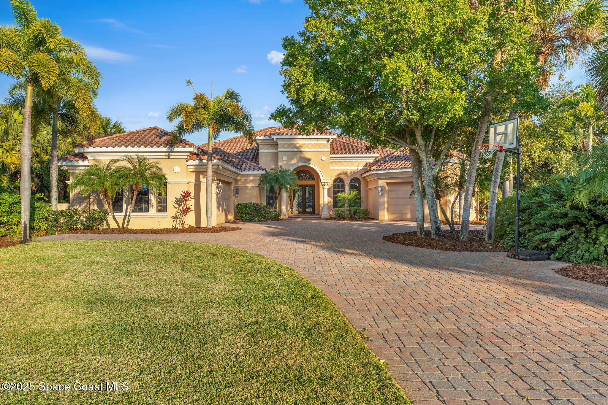 4447 Reseda Way Rockledge, FL 32955 - Photo 52 of 87 a front view of a building with a garden