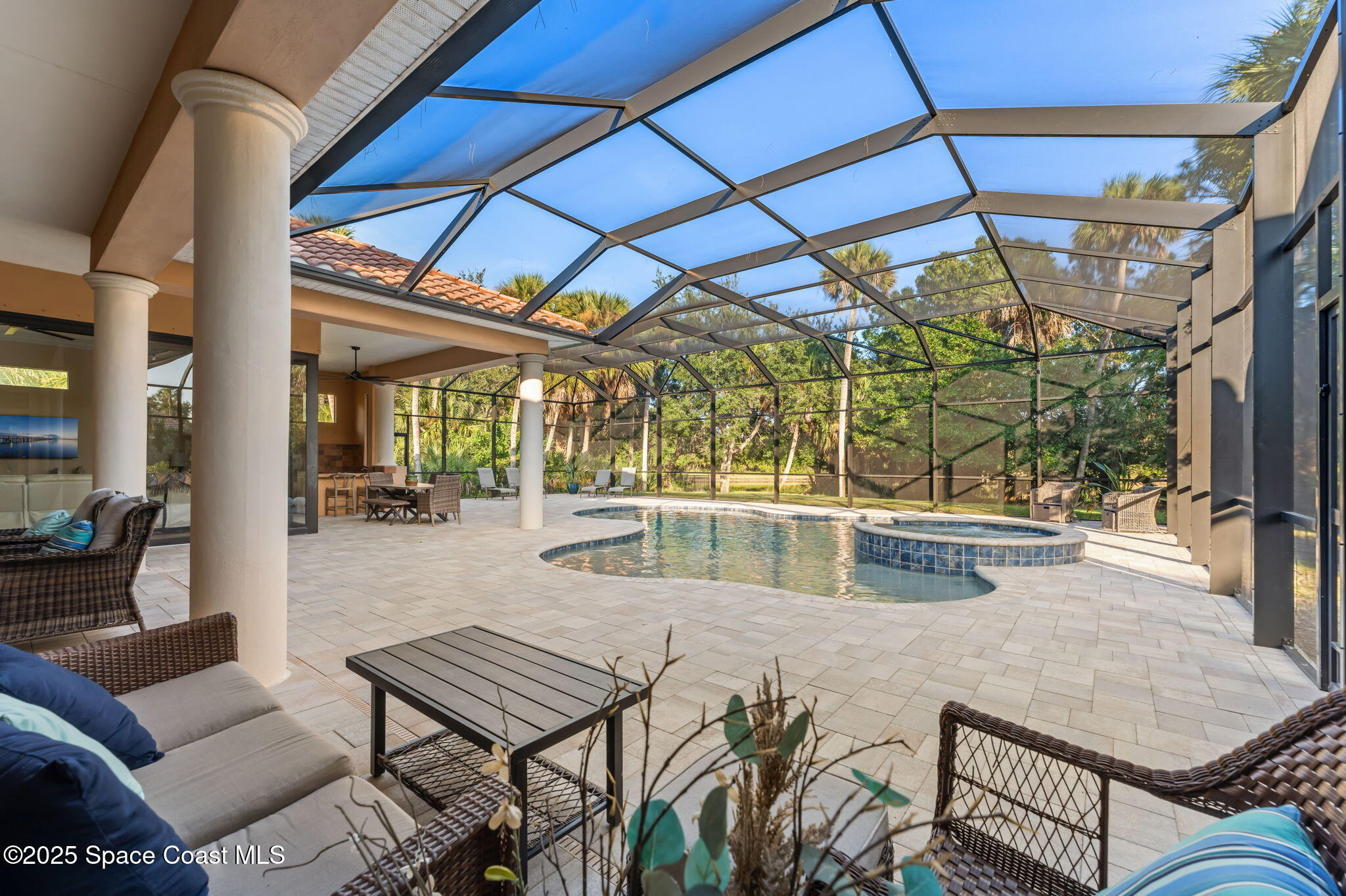 4447 Reseda Way Rockledge, FL 32955 - Photo 54 of 87 a view of a patio with a table and chairs