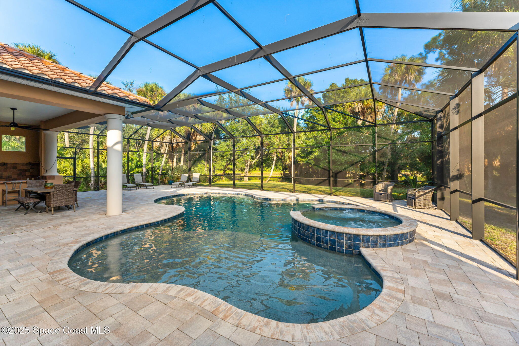 4447 Reseda Way Rockledge, FL 32955 - Photo 66 of 87 a view of a swimming pool with a patio